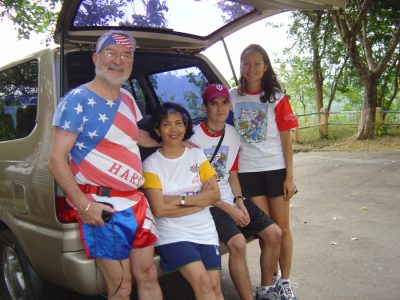 John and friends in hash shirts gathered at the back of a van before a run
