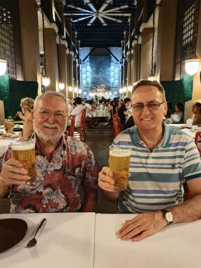 John enjoying some durian and friendship in Singapore