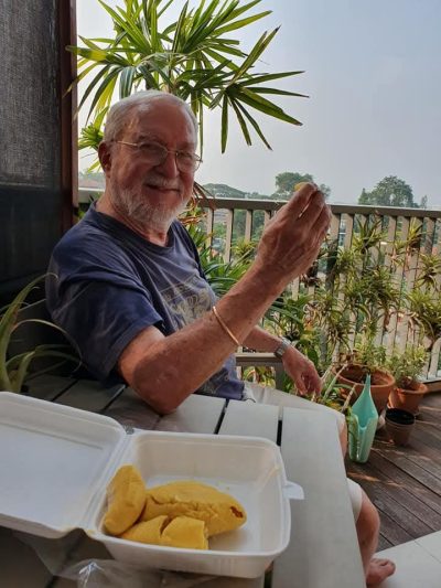 John enjoying some durian and friendship in Singapore